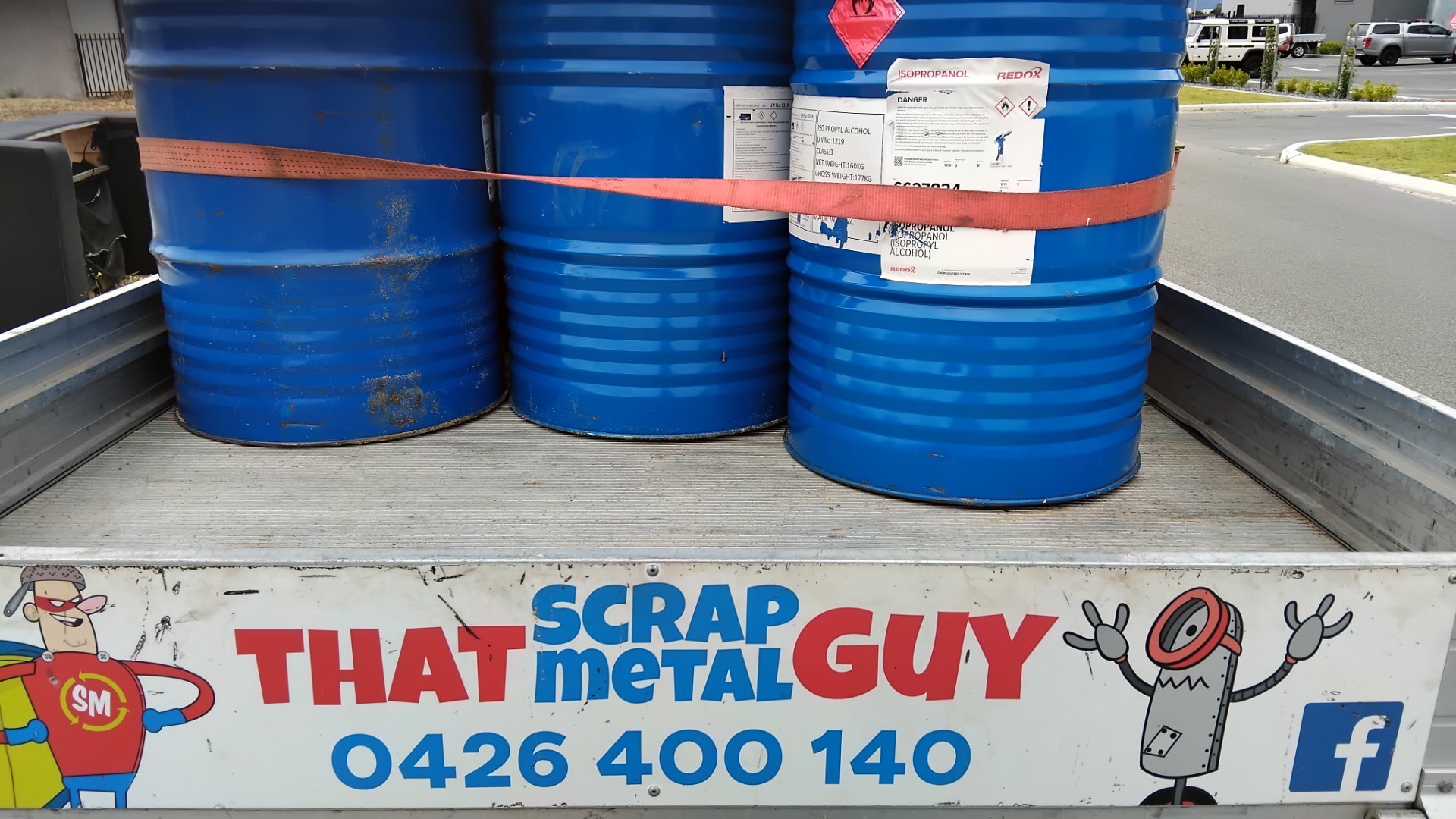 That Scrap Metal Guy branded truck loaded with steel drums